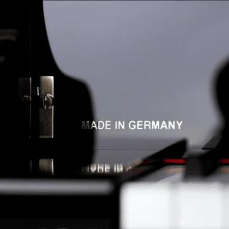 Close-up of a piano with "Made in Germany" inscription.