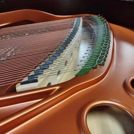 Close-up of piano strings inside the instrument.