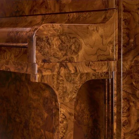 Close-up of ornate wooden furniture with intricate floral carvings.