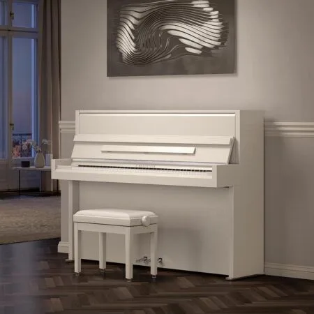 Elegant white piano with matching bench in a stylish room.