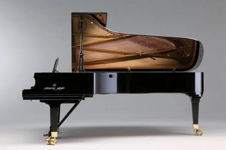 A grand piano with its lid open, showcasing its strings and hammers.