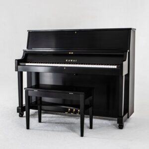 Black upright piano with matching bench on white background.