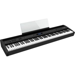 A black digital piano keyboard with music sheet holder.